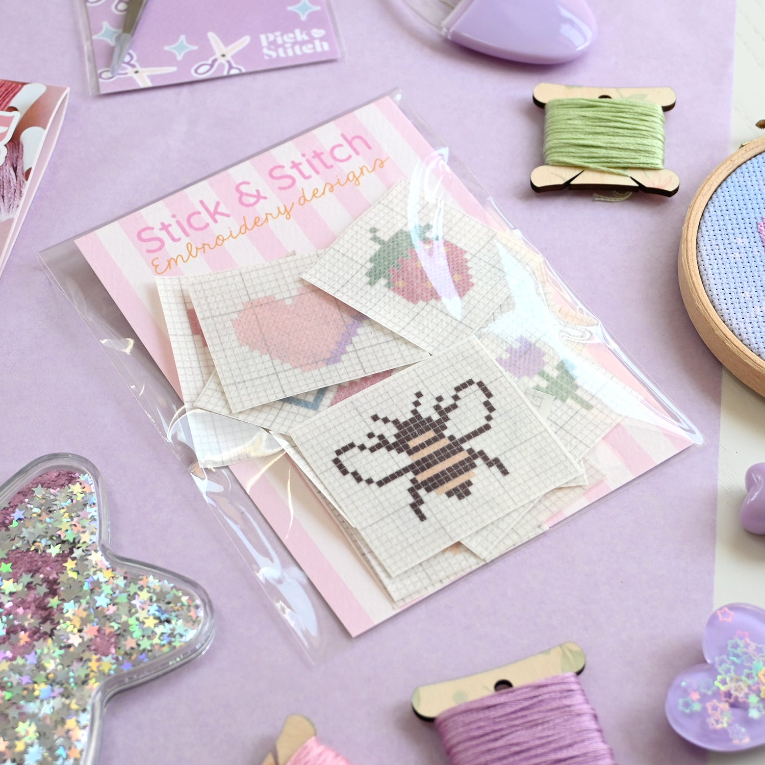 Pack of embroidery patches with cross-stitch pattern on a purple background