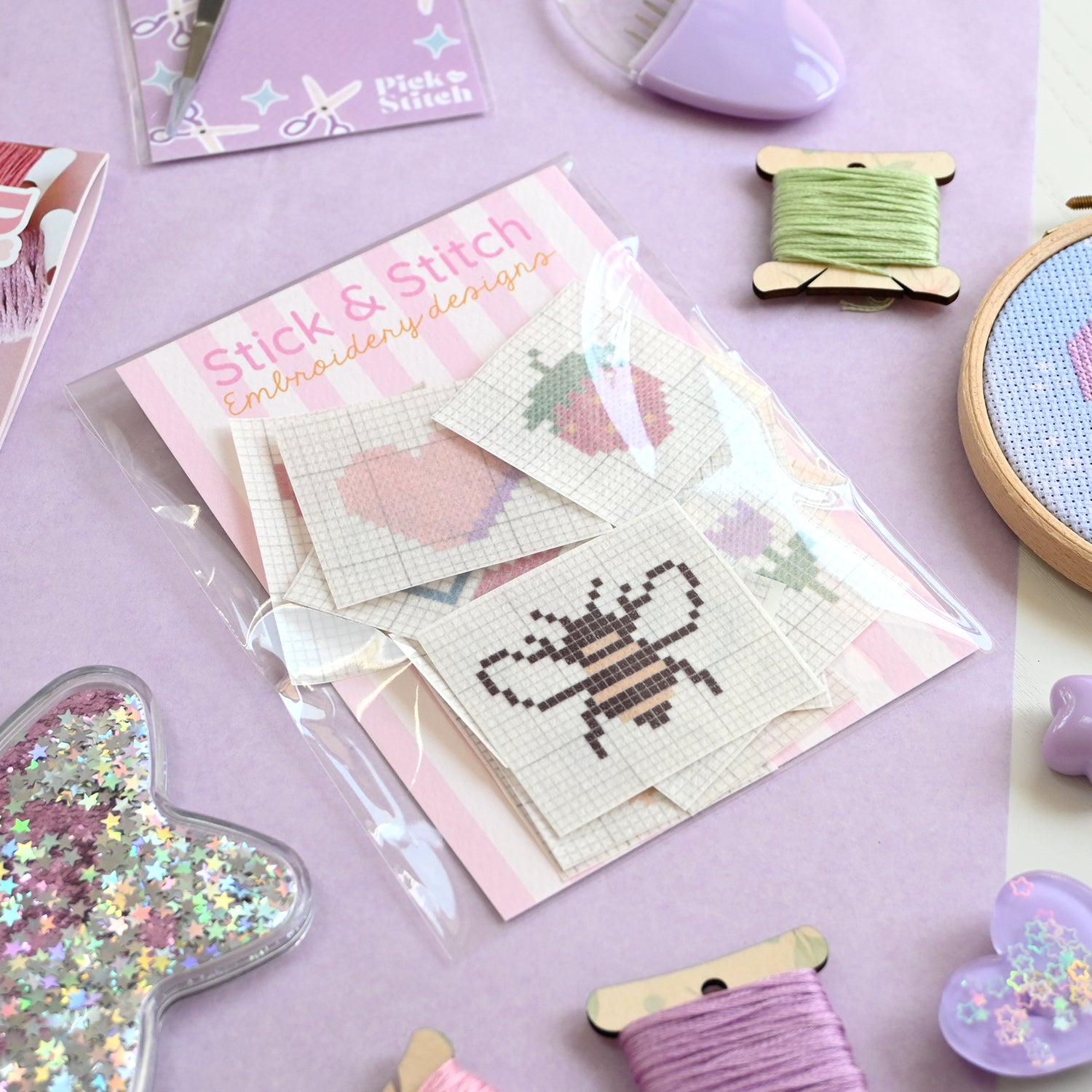 Embroidery patches with cross stitch patterns including a bee